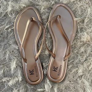 Rose gold flip flops